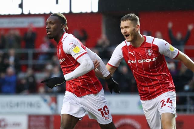 Rotherham United's Freddie Ladapo (left) celebrates scoring their side's first goal of the game during the Sky Bet League One match at the AESSEAL New York Stadium, Rotherham. Picture date: Saturday December 11, 2021. PA Photo. See PA story SOCCER Rotherham. Photo credit should read: Isaac Parkin/PA Wire.

RESTRICTIONS: EDITORIAL USE ONLY No use with unauthorised audio, video, data, fixture lists, club/league logos or "live" services. Online in-match use limited to 120 images, no video emulation. No use in betting, games or single club/league/player publications.