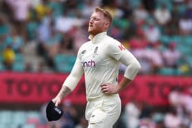Injured: England's Ben Stokes leaving the field with a side injury.