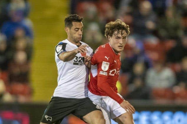 Barnsley's Callum Styles battles with Derby's Sam Baldock in their game in the autumn. Picture: Tony Johnson.