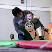 Afghan refugees in a playroom during a visit by the Duke of Cambridge to a local hotel in Leeds, in November 2020