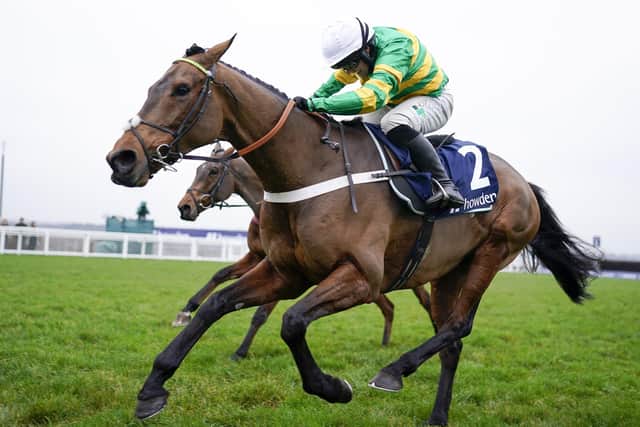 Champ and Jonjo O'Neill junior en route to Grade One glory in the Howden Long Walk Hurdle at Ascot's pre-Christmas meeting.