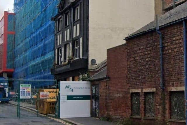 A Google Maps image from October 2021, showing construction work taking place around the old Yorkshireman's Arms pub in Burgess Street, Sheffield city centre - the pub is now subject to an emergency demolition order