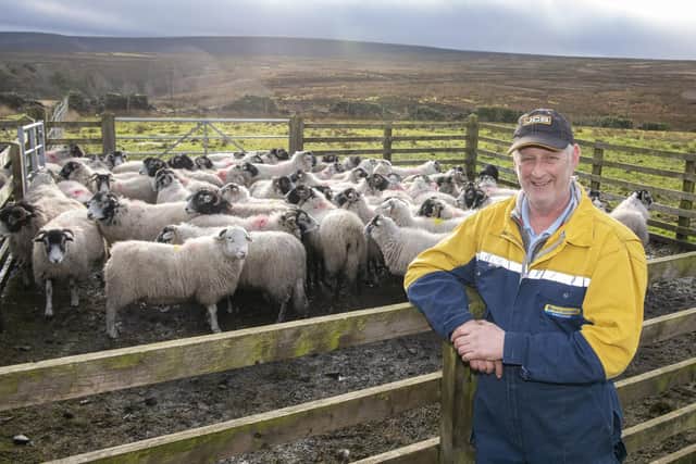 Andrew Howe at his farm near the Peak District hills