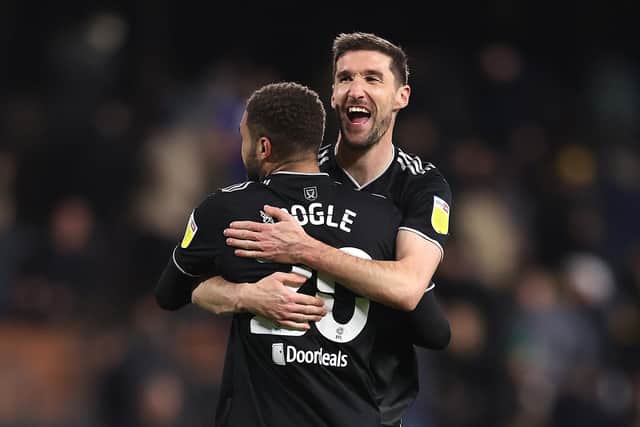 Chris Basham celebrates with Sheffield United team-mate Jayden Bogle after victory at Fulham in the Championship. (Photo by Alex Pantling/Getty Images)