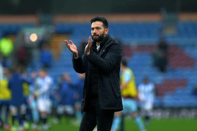 Carlos Corberan, pictured saluting Huddersfield Town's supporters at Burnley. Picture: Jonathan Gawthorpe.