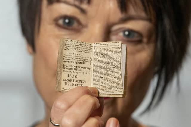 Principle curator Ann Dinsdale at the Brontë Parsonage Museum in Haworth with one of the five Little Books by Charlotte Brontë at the venue. A sixth Little Book, the final one of the set, is due to arrive at the museum in the spring. (Picture Tony Johnson)