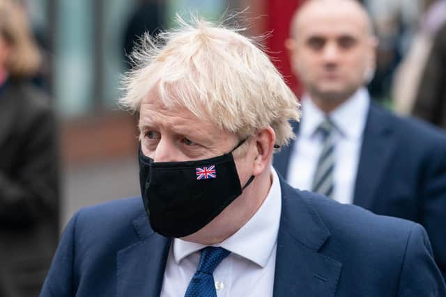 Prime Minister Boris Johnson in Uxbridge, west London, after a visit to a Boots Pharmacy coronavirus vaccination clinic.