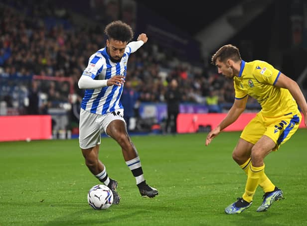 WIDE BOY: Huddersfield Town's Sorba Thomas makes a move past Blackburn Rovers' Harry Pickering earlier this season. Picture: Bruce Rollinson