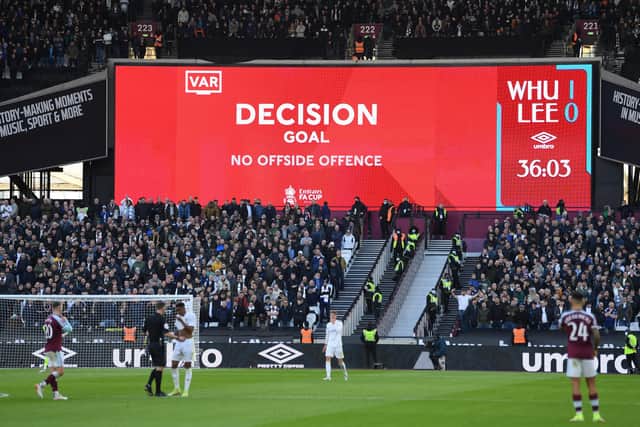 DECISIONS, DECISIONS: The LED screen displays the VAR decision to allow the West Ham United first goal scored by Manuel Lanzini at London Stadium. Picture: Mike Hewitt/Getty Images