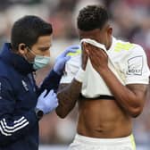 Injured: Junior Firpo reacts as he receives medical treatment during the Emirates FA Cup third round match between West Ham United and Leeds United at London Stadium. Picture: Getty Images