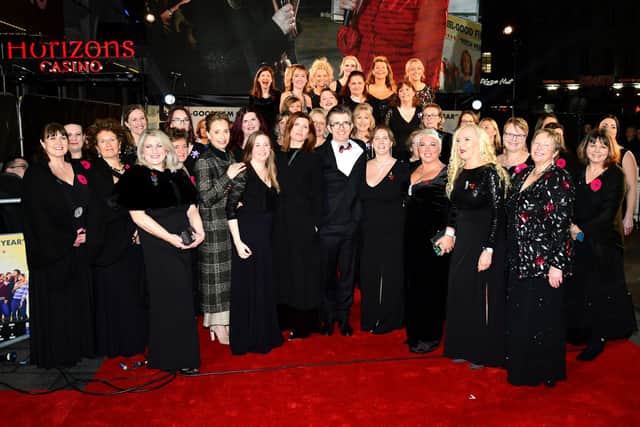 Kristin Scott Thomas, Gareth Malone and Sharon Horgan with the Combined MIlitary Wives Choir attending the Military Wives UK premiere held in Leicester Square, London, in Feb 2020. Picture: Ian West/PA.