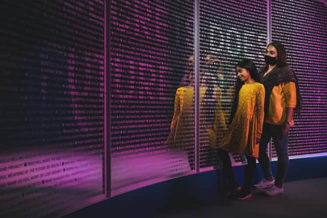 Visitors are pictured looking at a wall of words while attending the Top Secret exhibition at the Science and Industry Museum in Manchester in the spring of last year. (Photo: The Science Museum Group)