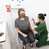 A woman receives a Covid vaccination in Leeds in December.