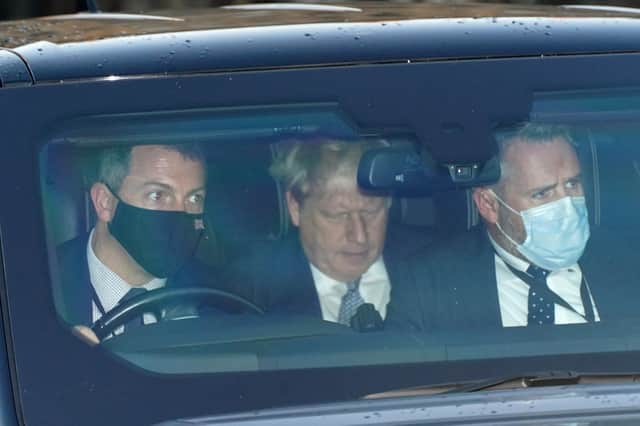 Prime Minister Boris Johnson (centre) leaves the Houses of Parliament in Westminster, London (PA)
