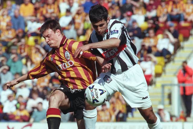 Playing days: Bradford's Ashley Westwood tussles with Jack Lester.