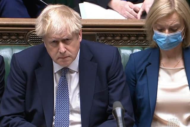 Boris Johnson started Prime Minister's Questions with an apology over Downing Street parties that were in breach of lockdown laws.