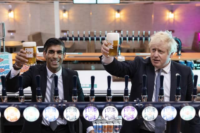 In happier times - Boris Johnson and Rishi Sunak visit a brewery after the Budget last October.