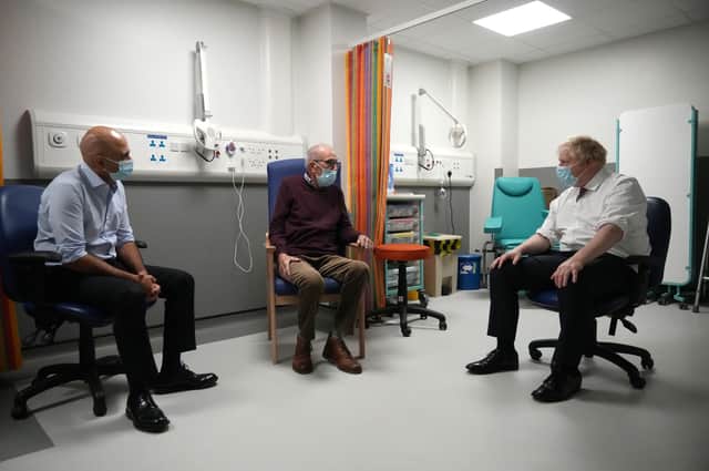 Prime Minister Boris Johnson (right) and Health Secretary Sajid Javid (left) speak with patient Arthur McCune during a visit to Leeds General Infirmary in West Yorkshire.