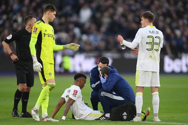 Junior Firpo of Leeds United receives medical treatment during the Emirates FA Cup Third Round match at West Ham United. Picture: Mike Hewitt/Getty Images