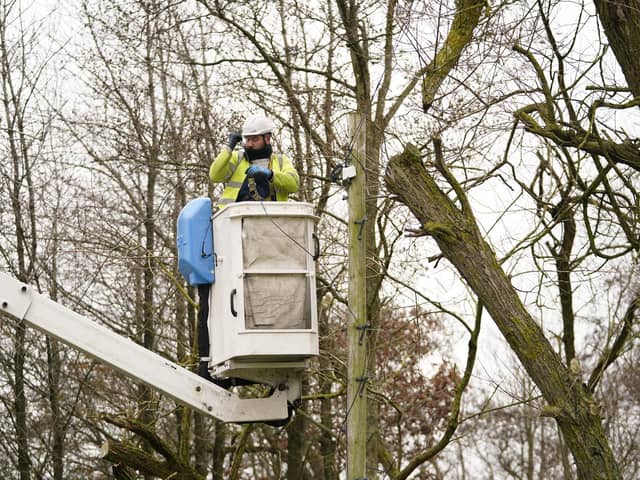 An Openreach engineer fixes telephone lines near Barnard Castle in County Durham in the aftermath of Storm Arwen (PA)