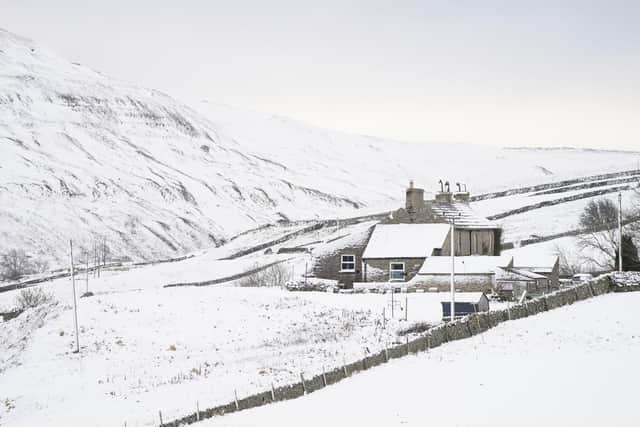 Snow covers fields and hills surrounding High Green in the Yorkshire Dales, amid freezing conditions in the aftermath of Storm Arwen. Image: Danny Lawson/PA wire
