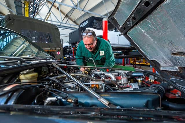 Classic car mechanic David Osborn working on a Jaguar XJ12