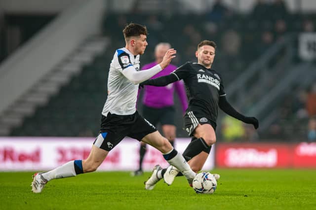 TAACKLE: Oliver Norwood contests for the ball