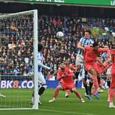 Huddersfield Town captain Jonathan Hogg wins the air miles against Swansea City. Picture: Bruce Rollinson.