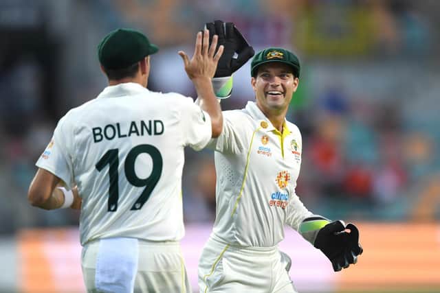 Australia's Scott Boland (left) and Alex Carey (right) of Australia celebrates the wicket of England's Sam Billings during day two of the fifth Ashes test at the Blundstone Arena, Hobart. Picture: PA Wire.