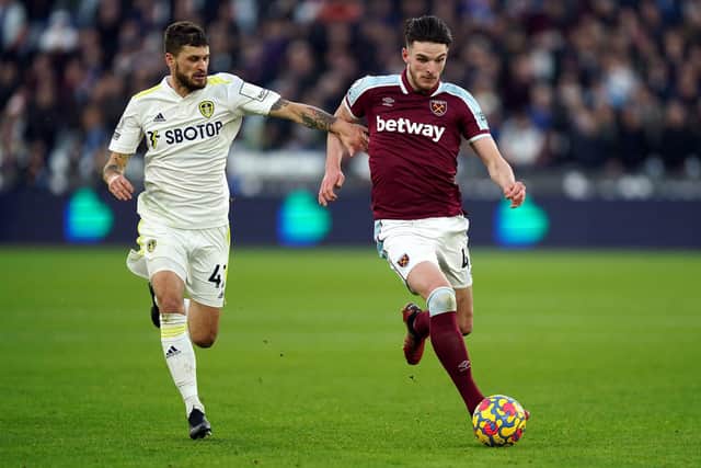 TOUGH GOING: West Ham United's Declan Rice (right) and Leeds United's Mateusz Klich battle for the ball during the Premier League match at the London Stadium. Picture: PA Wire.