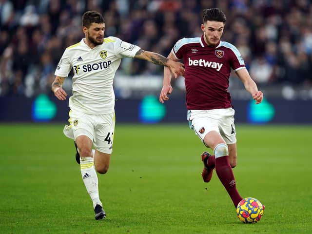 TOUGH GOING: West Ham United's Declan Rice (right) and Leeds United's Mateusz Klich battle for the ball during the Premier League match at the London Stadium. Picture: PA Wire.