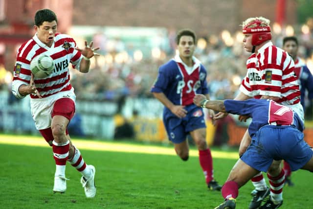 Wigan stand-off Henry Paul takes a pass from Mick Cassidy on his way to one of his three tries against Paris St. Germain in a league match at Central Park on Sunday 5th of May 1996. Wigan won the game 76-8.