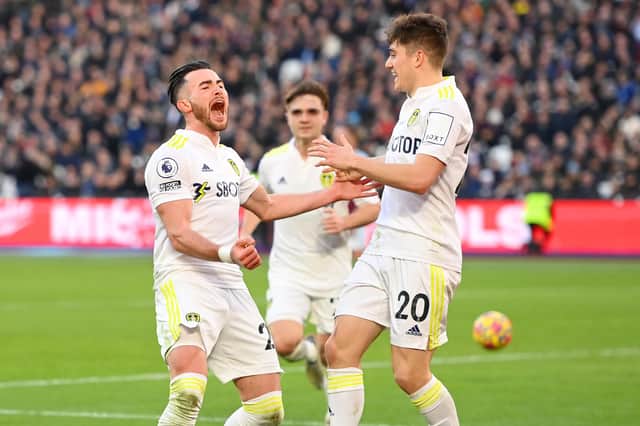 Jack Harrison celebrates with Daniel James. (Photo by Mike Hewitt/Getty Images)