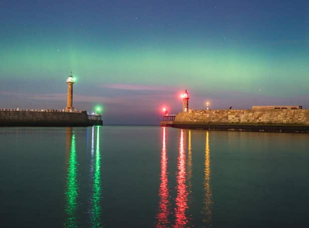 Chris Evans captured this image of the Northern Lights off Whitby, seen here beyond the town's twin piers.