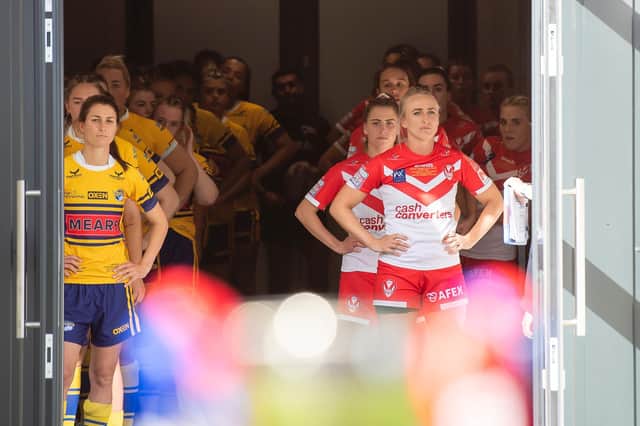 Leeds Rhinos and St Helens prepare to come out to the field of play for the 2021 Betfred Super League Grand Final led by Courtney Winfield-Hill and Jodie Cunningham. (Allan McKenzie/SWpix.com)