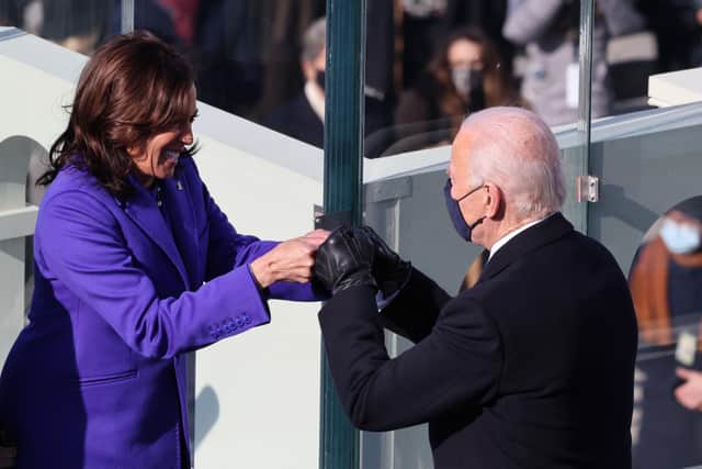 Vice President Kamala Harris celebrates with President-elect Joe Biden after being sworn in during the inauguration on the West Front of the U.S. Capitol on January 20, 2021 in Washington, DC.