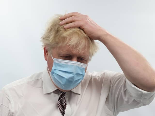 Prime Minister Boris Johnson talks to staff during a visit to the Finchley Memorial Hospital in North London