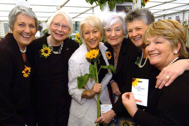 Library image of Dame Helen Mirren, who played the role of Patricia Stewart, in the film. She is pictured with five of the Calendar Girls at the Chelsea Flower Show. From left, Angela Baker, Beryl Bamforth, Lynda Logan, Chris Clancy and Ros Fawcett. Picture: JPI Media