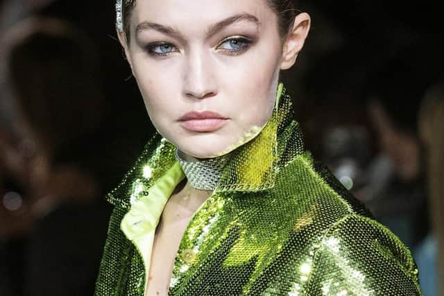 Green shimmer: Model Gigi Hadid walks the runway at the Tom Ford spring/summer 2022 fashion show at Lincoln Center during New York Fashion Week. (AP Photo/Eduardo Munoz Alvarez)