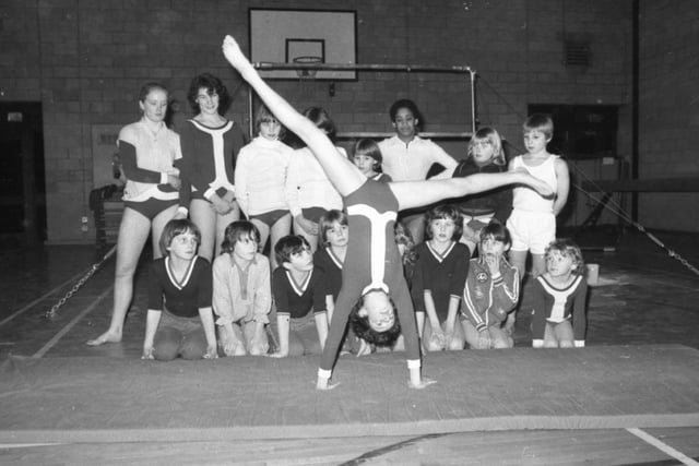 The world may watch the Russian and Romanian gymnasts and gasp in wonder and admiration. But the Garstang gymnasts have a lot more fun. Garstang Gymnasts Club is a typical example of the many clubs which have sprung up around the country and is run by a team of dedicated volunteers. Pictured: Eleven-year-old Laura Bolton demonstrates a cartwheel to the other members of the club