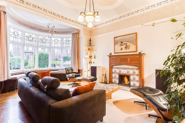 This room has a central fireplace and decorative bay window to add character and interest.