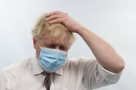 Prime Minister Boris Johnson talks to staff during a visit to the Finchley Memorial Hospital in North London where his interview with Sky News political editor Beth Rigby led to renewed questions about his premiership.