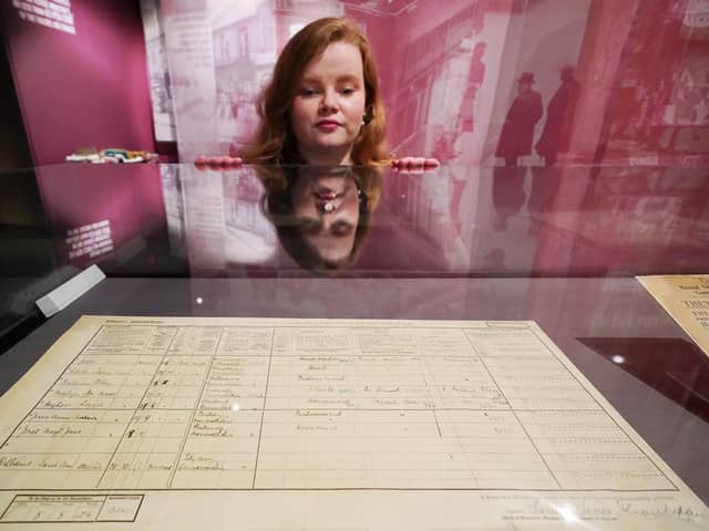 A member of staff observes the original 1921 census return for Downing Street, London, which is on display at the National Archives in Kew in London, for a new exhibition, The 1920s: Beyond the Roar. The exhibition marks the publication of the 1921 Census for England and Wales and allows visitors to explore 1920s life. (Photo: Jonathan Brady/PA Wire)