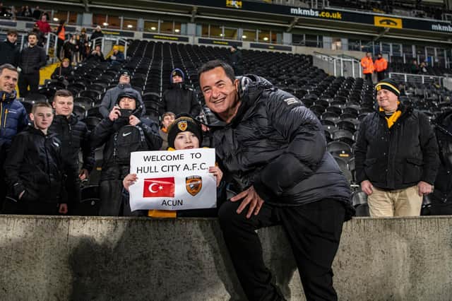 NEW OWNER: Acun Ilicali is welcomed to Hull City by a young fan
