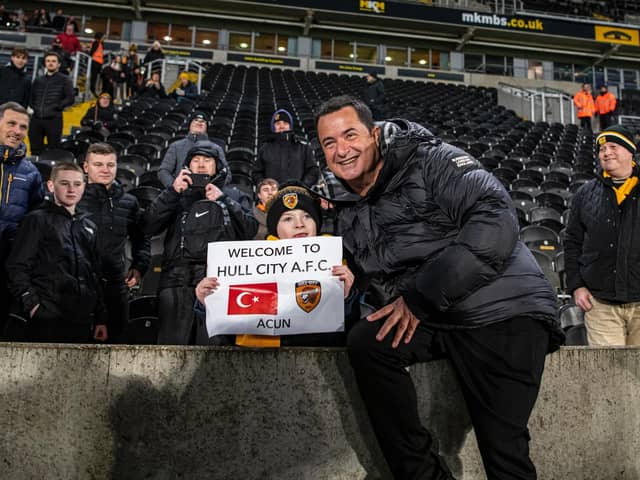 NEW OWNER: Acun Ilicali is welcomed to Hull City by a young fan