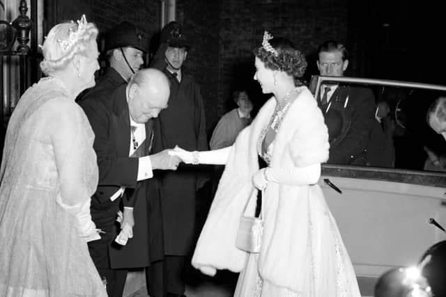 File photo dated 05/04/1955 of Prime Minister Sir Winston Churchill bowing to Queen Elizabeth II as he welcomes her and the Duke of Edinburgh to 10 Downing Street for dinner - one of the many biographies of Churchill is by Boris Johnson.