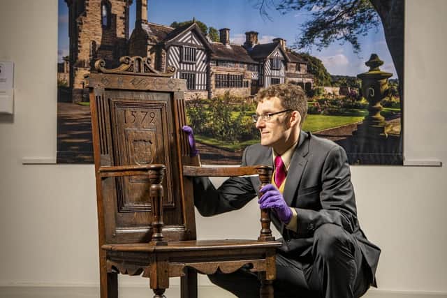 Curator Eli Dawson with a chair owned by Anne Lister on display at the Shibden 600 exhibition. Picture: Tony Johnson