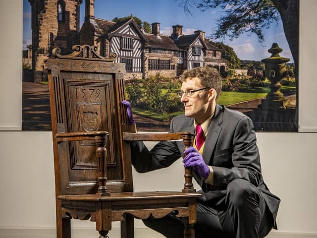 Curator Eli Dawson with a chair owned by Anne Lister on display at the Shibden 600 exhibition. Picture: Tony Johnson