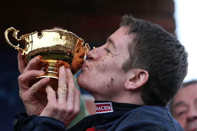 Jockey Barry Geraghty celebrates the 2013 Cheltenham Gold Cup win of Bobs Worth.