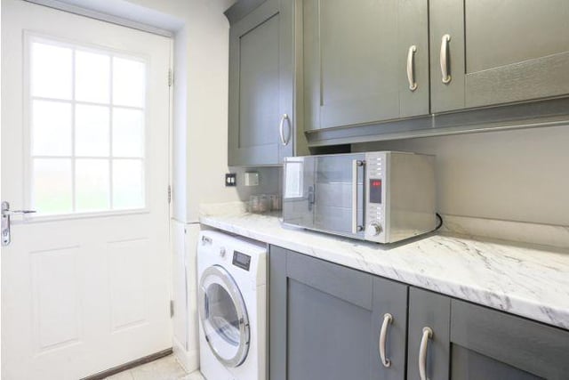 It also boasts a useful separate utility room.